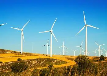 Wind farm at farmland in summer. Aragon